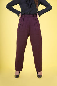 High Rise Pleated Parallel Trousers - These trousers feature a flattering high-waist design with elegant pleats, offering a classic yet versatile look. Crafted with attention to detail and comfort in mind, they provide a tailored fit suitable for various events. Ideal for the office or upscale outings, our High Rise Pleated Parallel Trousers are a wardrobe essential.