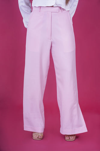 High Rise Side Slit Trousers - These trousers feature a flattering high-rise waist and chic side slits, adding a modern twist to a classic design. Crafted with comfort and contemporary fashion in mind, they offer a sleek and tailored fit that complements various occasions.