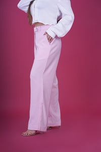 High Rise Side Slit Trousers - These trousers feature a flattering high-rise waist and chic side slits, adding a modern twist to a classic design. Crafted with comfort and contemporary fashion in mind, they offer a sleek and tailored fit that complements various occasions.