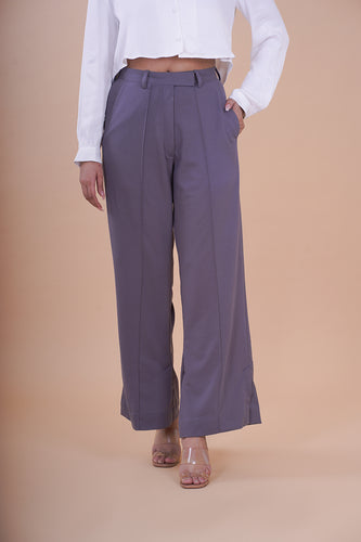 High Rise Pleated Side Slit Trousers - These trousers feature a flattering high-rise waist and chic side slits, adding a modern twist to a classic design. Crafted with comfort and contemporary fashion in mind, they offer a sleek and tailored fit that complements various occasions.