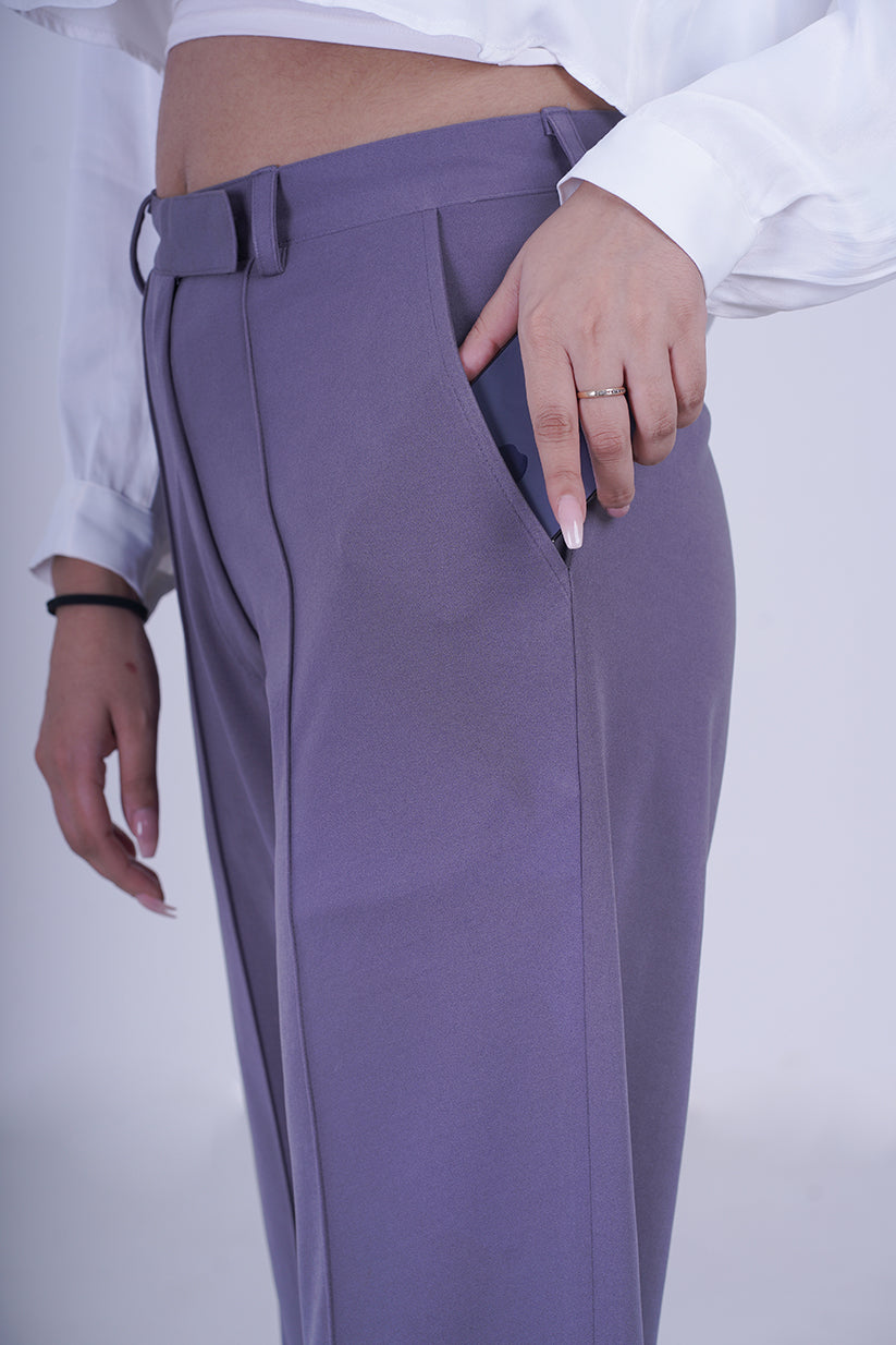 High Rise Pleated Side Slit Trousers - These trousers feature a flattering high-rise waist and chic side slits, adding a modern twist to a classic design. Crafted with comfort and contemporary fashion in mind, they offer a sleek and tailored fit that complements various occasions.